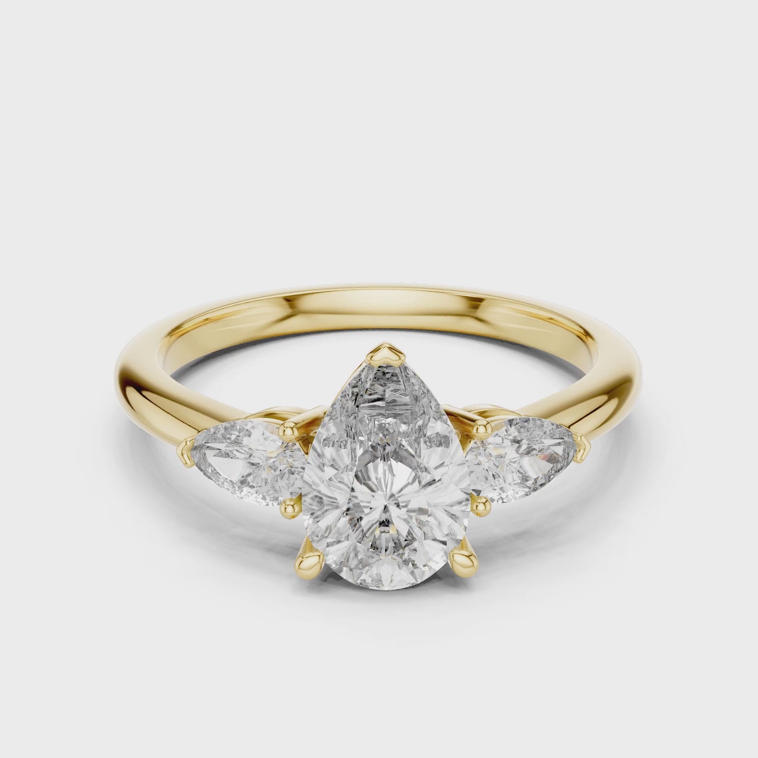Sienna 1 Carat Pear Lab Grown Diamond Graduated Three Stone Ring - Yellow Gold video