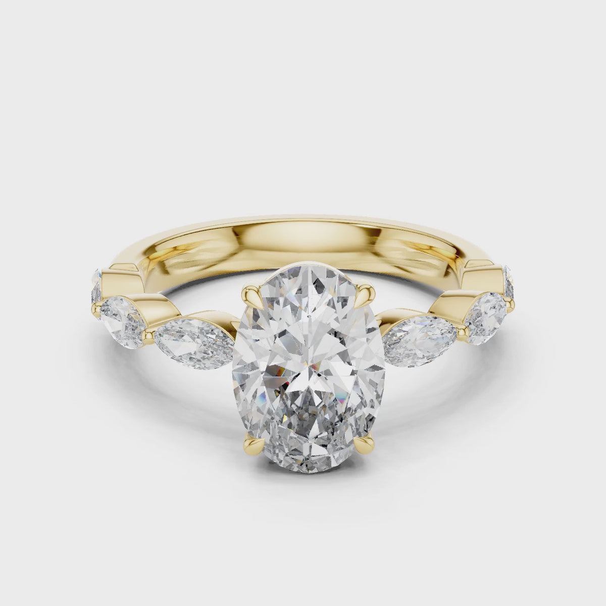 Flora 2 Carat Oval Lab Grown Diamond Graduated Engagement Ring - Yellow Gold video