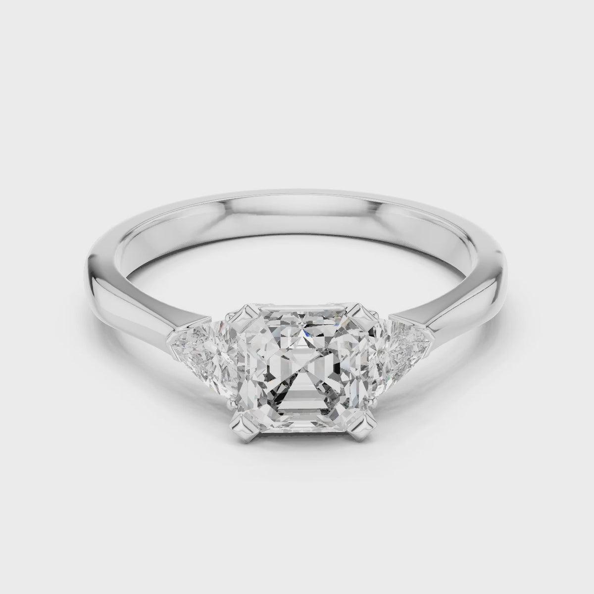 Vera 2 Carat Emerald Lab Grown Diamond Trillion Accent Three Stone Ring - White Gold video