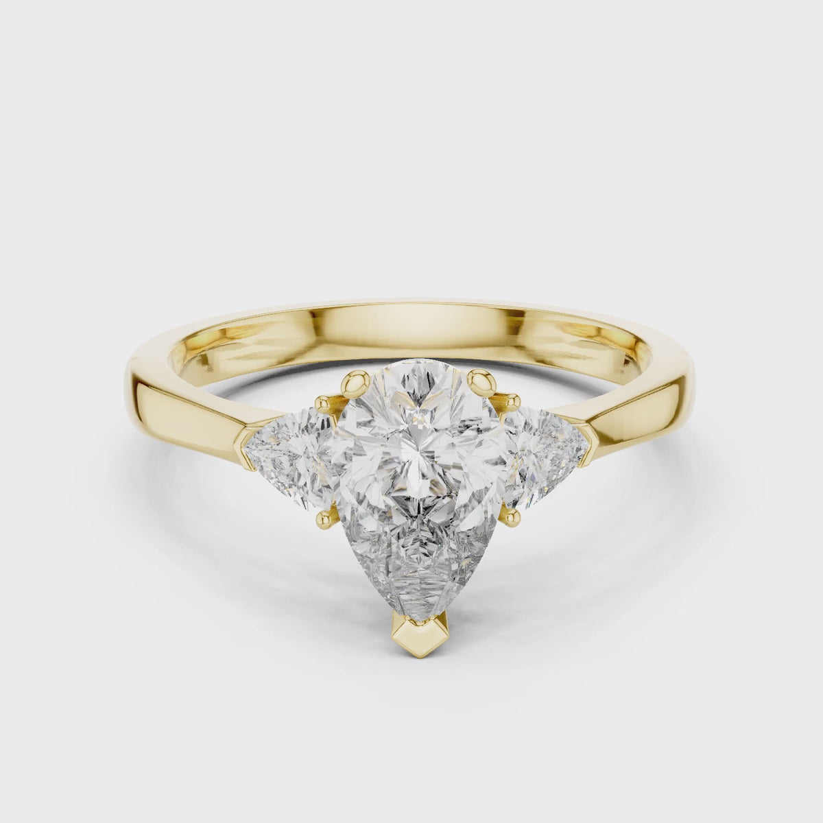 Sienna 1 Carat Pear Lab Grown Diamond Collet Three Stone Ring - Yellow Gold video