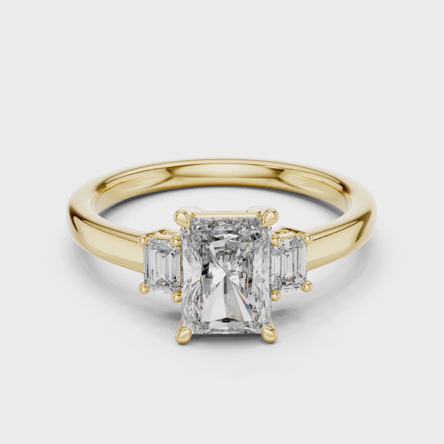 Vera 1.5 Carat Radiant Lab Grown Diamond Three Stone Ring - Yellow Gold video